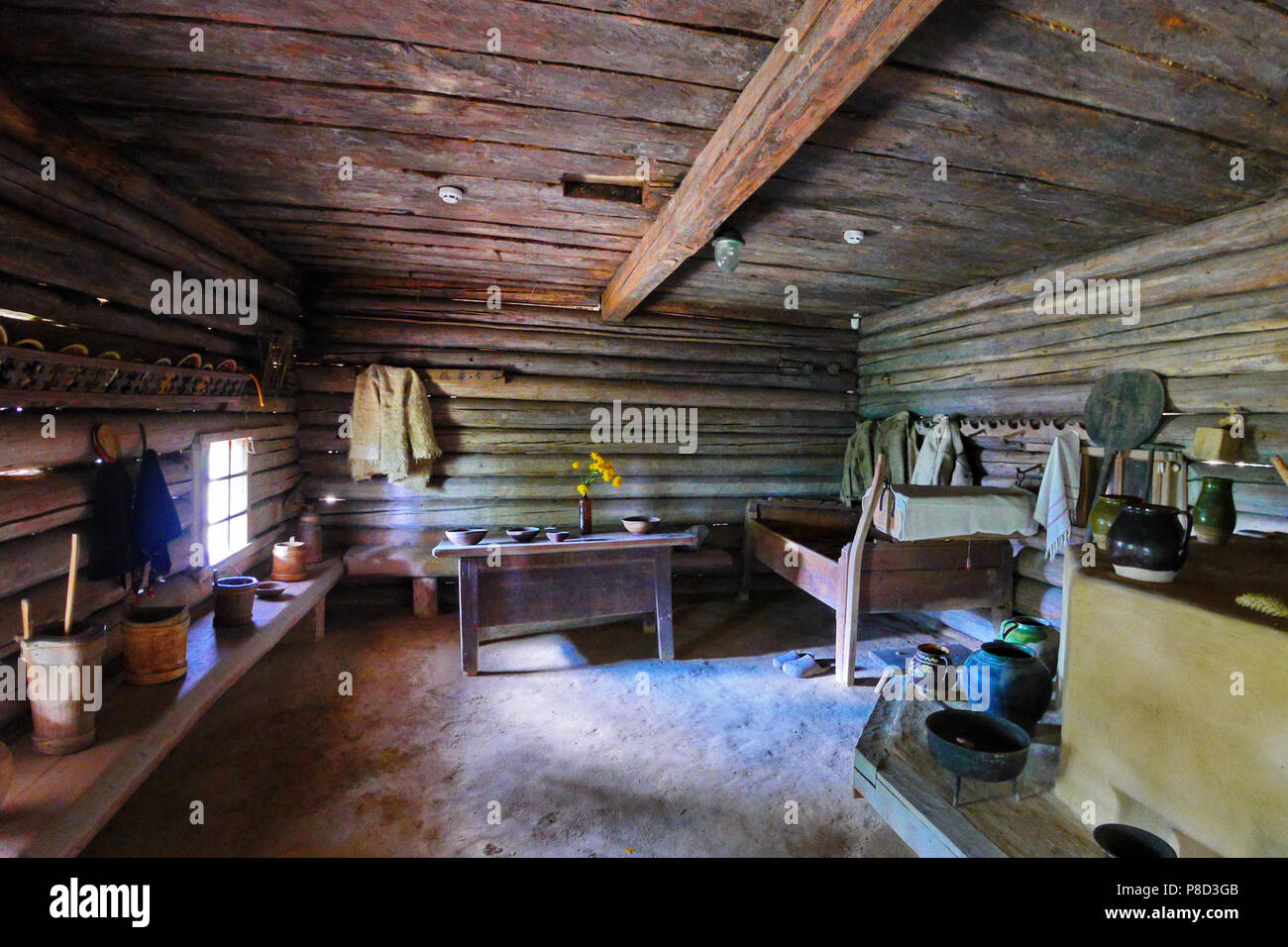 The Squat Ceiling In A Rural House With Wooden Furniture And Pottery 