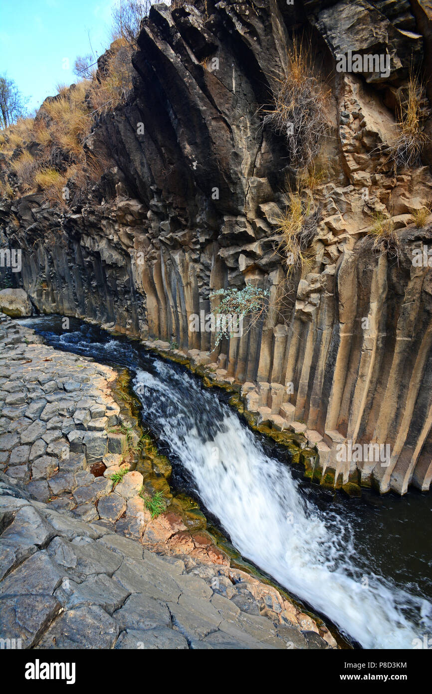 Meshushim canyon bed surrounded by impressive hexagonal basalt pillars ...