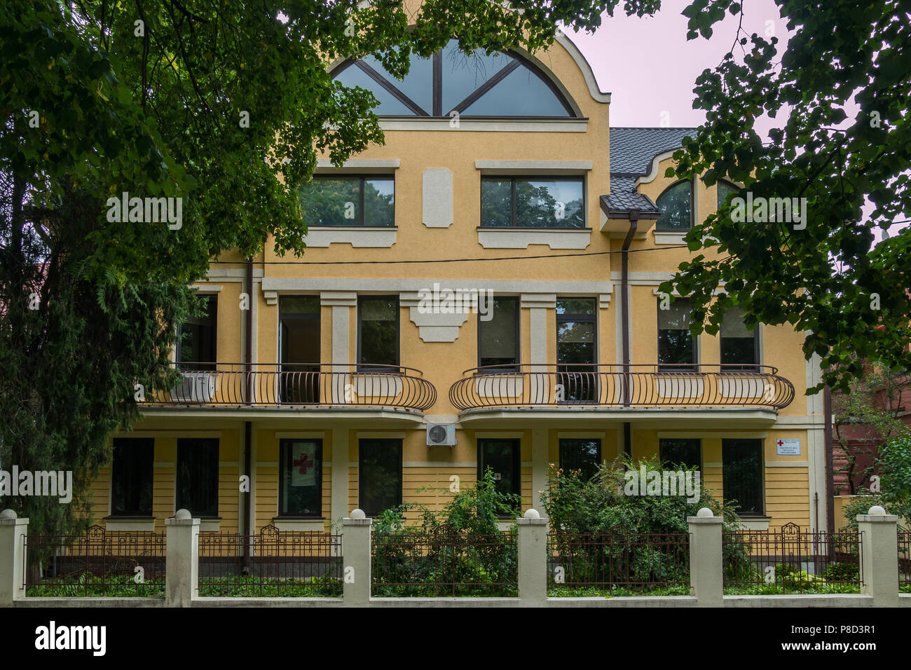 Behind Building A beautiful view of the facade of the building with balconies standing ...