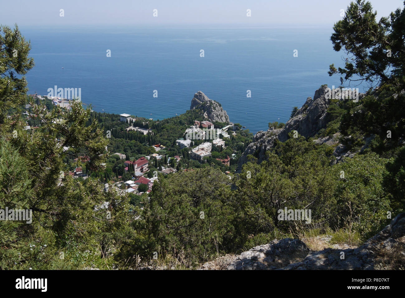 a quiet coastal town under a blue sky on the background of the boundless sea . For your design Stock Photo