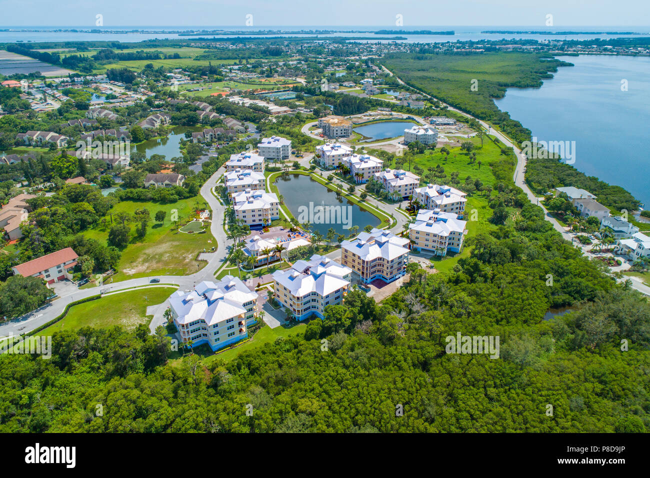 Aerial view of a Planned Bradenton Florida residential 55+ retirement community of single family condominium homes surrounding a small lakes with a ga Stock Photo