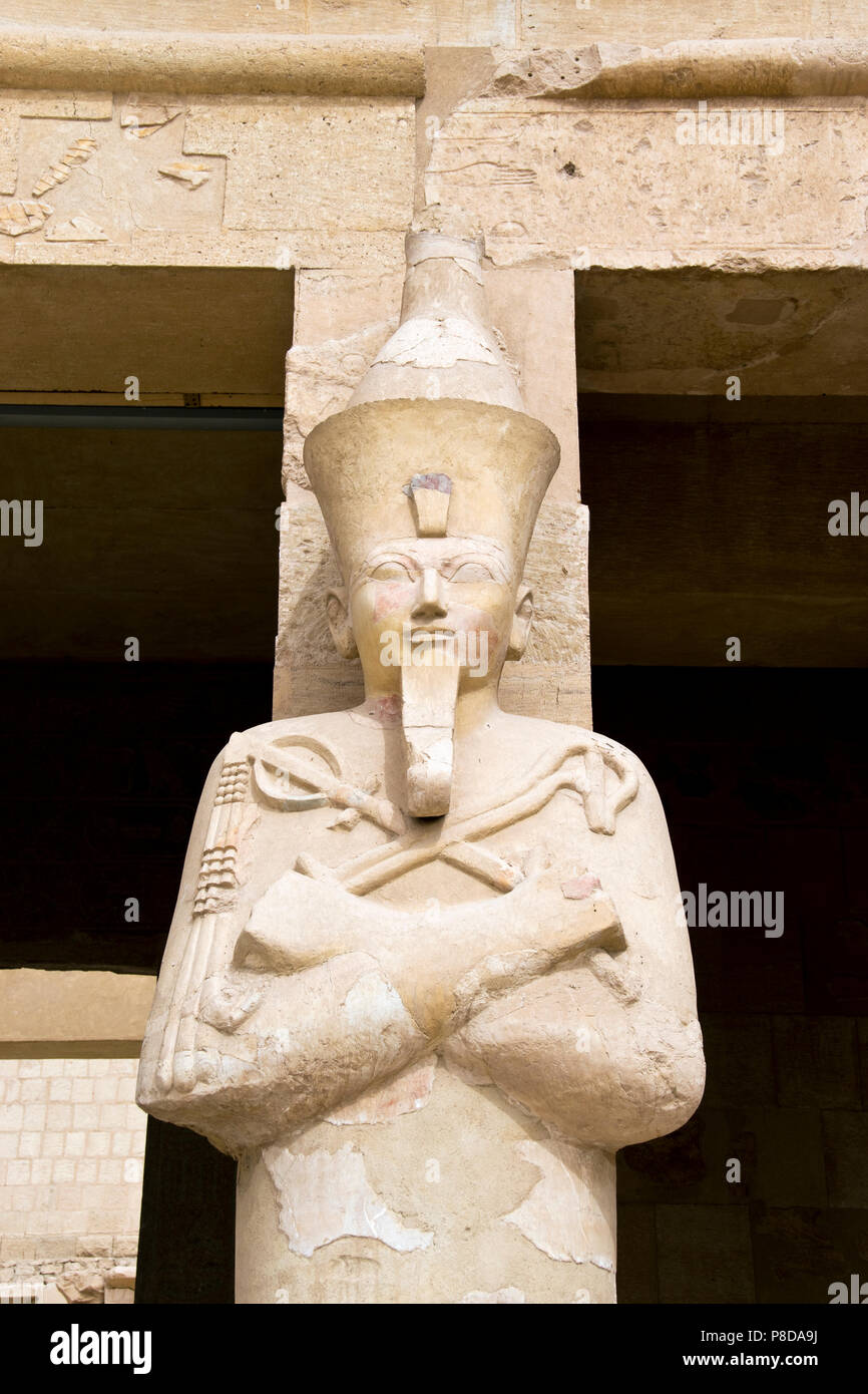 A statue of the female pharaoh Hatshepsut depicted with a false beard, symbol of pharaonic power at the Mortuary Temple of Hatshepsut, Luxor, Egypt. Stock Photo