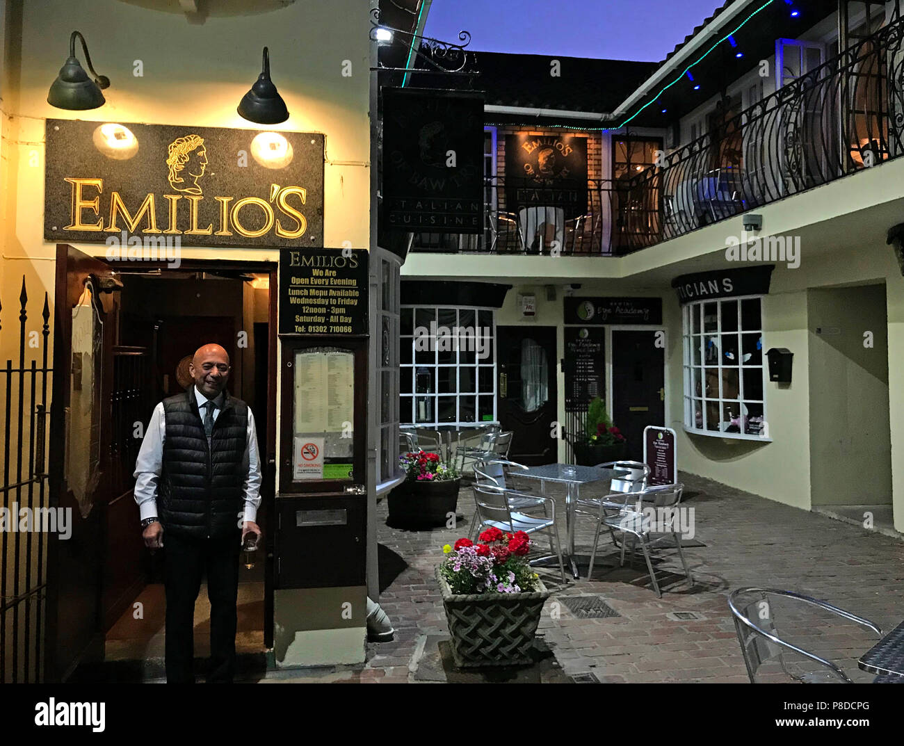 Emilio outside Emelios at dusk, 5-6 Dower House Square, Bawtry, Doncaster, South Yorkshire, England, UK, DN10 6LS Stock Photo