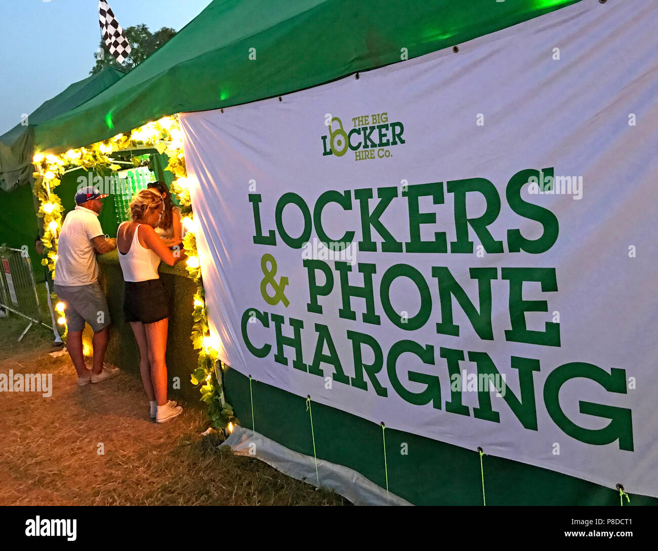 The Big Locker Hire Co, Lockers & Phone Charging, essential , festival,event services, people buying charge Stock Photo
