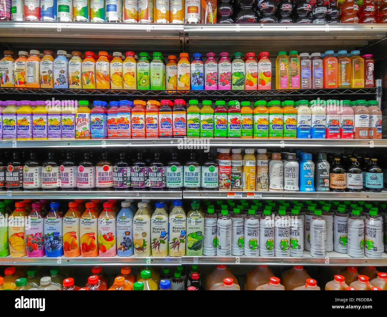 A cooler in a supermarket in New York offers juices, protein shakes, teas water, and almost