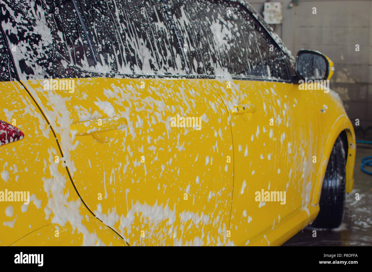 Car wash with foam in car wash Stock Photo Alamy