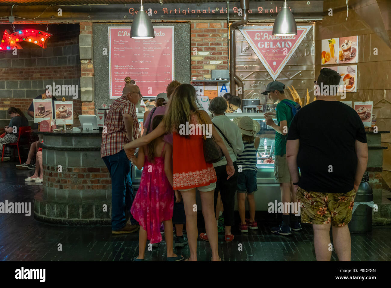 Visitors to Chelsea Market in New York stay indoors and beat the heat wave at the L'Arte del Gelato kiosk on Tuesday, July 3, 2018. The National Weather Service has issued a hot weather advisory until Wednesday evening citing the oppressive heat and humidity. (Â© Richard  B. Levine) Stock Photo