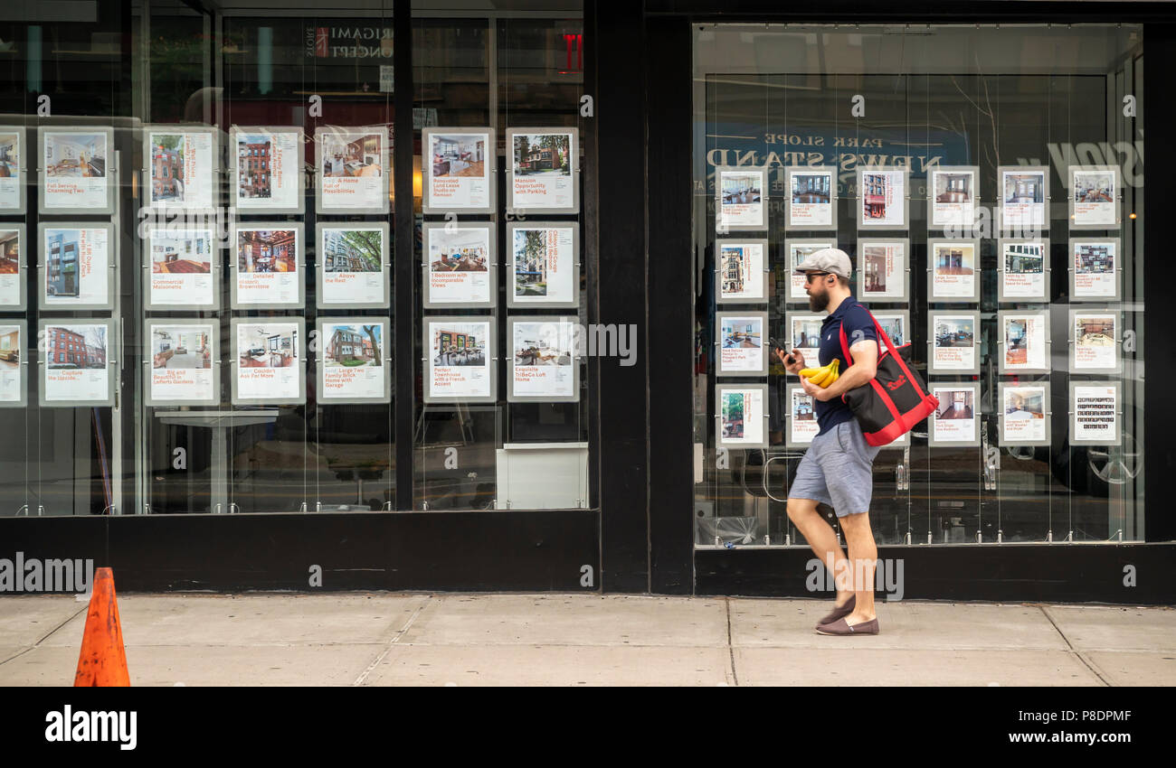 Brown Harris Stevens real estate brokers' listings in the family-friendly, trendy Park Slope neighborhood in Brooklyn in New York on Wednesday, July 4, 2018. (Â© Richard B. Levine) Stock Photo