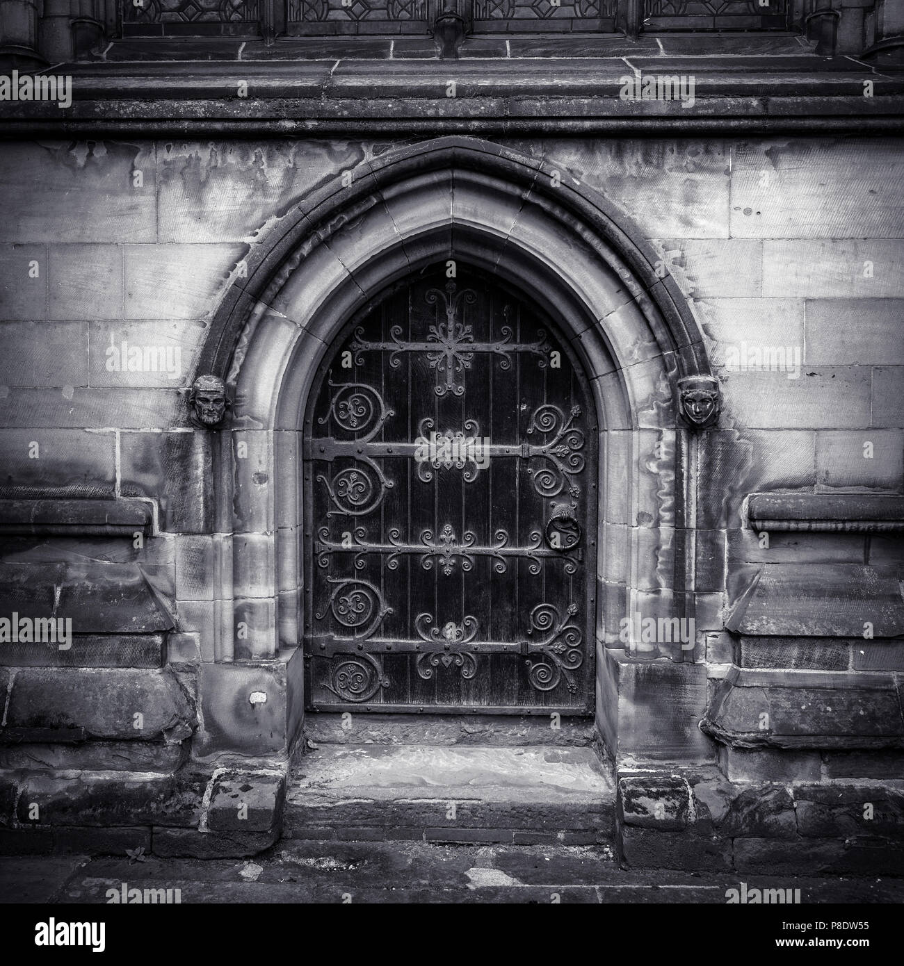 Black and white ornate gothic medieval arched door. Stock Photo