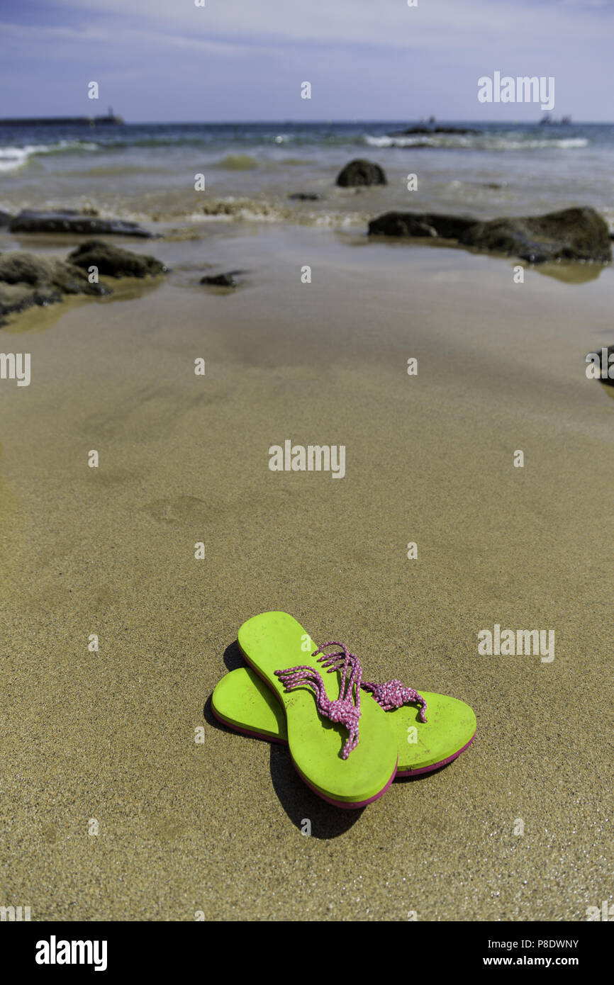 Flip-flops on the beach, summer vacation and detail Stock Photo - Alamy