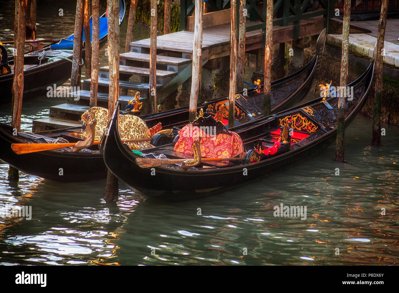 Gondolas at a pier in Venice, Italy Stock Photo