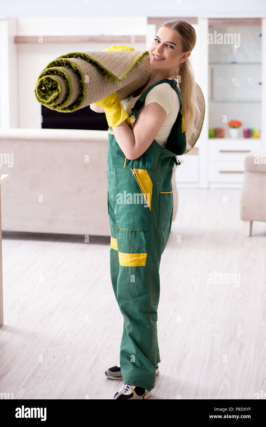 Professional female cleaner cleaning carpet Stock Photo Alamy
