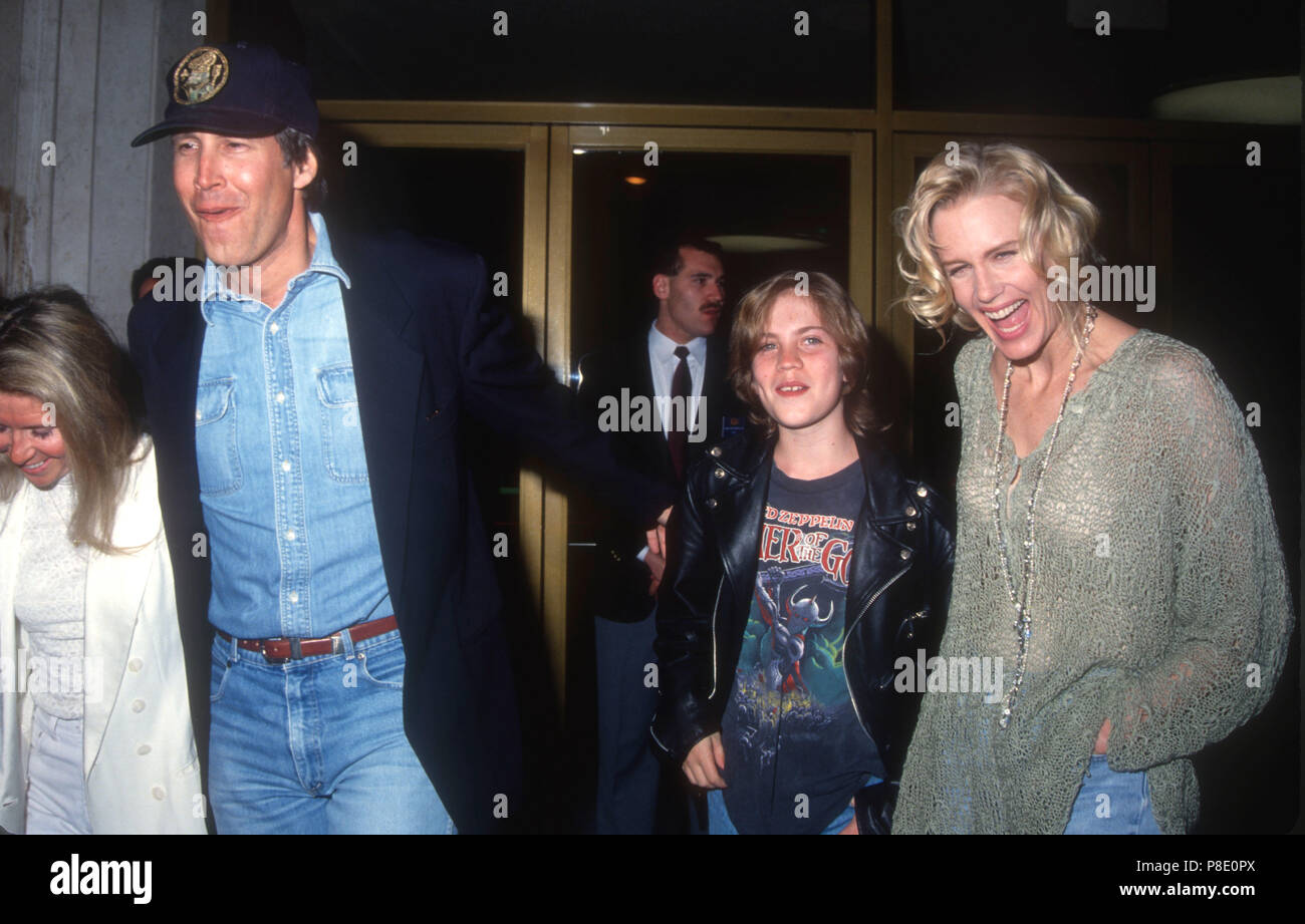 WESTWOOD, CA - FEBRUARY 25: Jayni Chase and husband Actor Chevy Chase, actress Daryl Hannah and nephew Jeremiah attend 'Memoirs of an Invisible Man' Premiere on February 25, 1992 at Mann's National Theater in Westwood, California. Photo by Barry King/Alamy Stock Photo Stock Photo