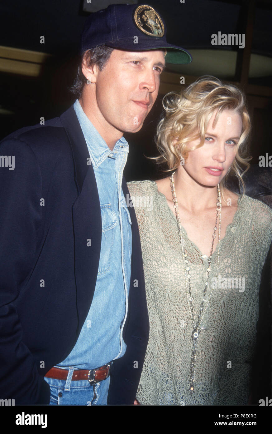 WESTWOOD, CA - FEBRUARY 25: (L-R) Actor Chevy Chase and actress Daryl Hannah attend 'Memoirs of an Invisible Man' Premiere on February 25, 1992 at Mann's National Theater in Westwood, California. Photo by Barry King/Alamy Stock Photo Stock Photo