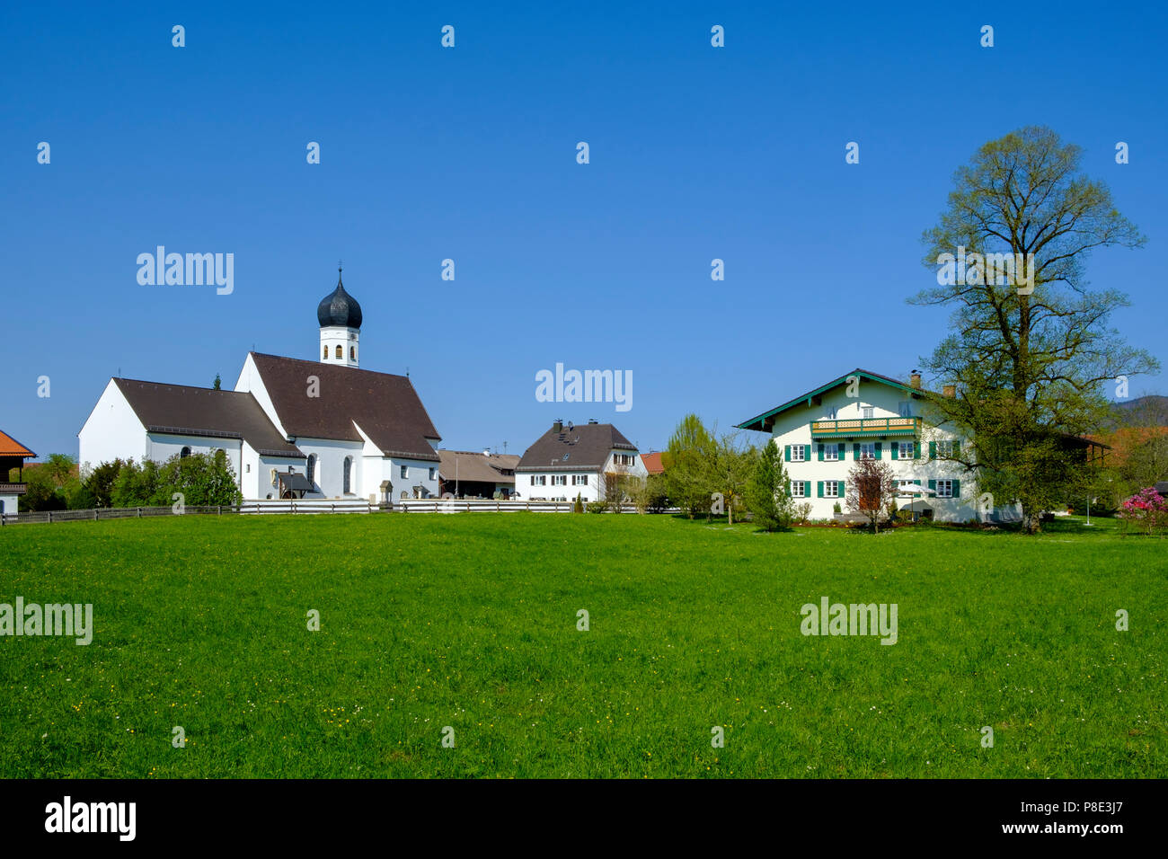 St. Michael am Lake Kochelsee with view to the Herzogstand and Heimgarten, Upper Bavaria, Bavaria, Germany Stock Photo