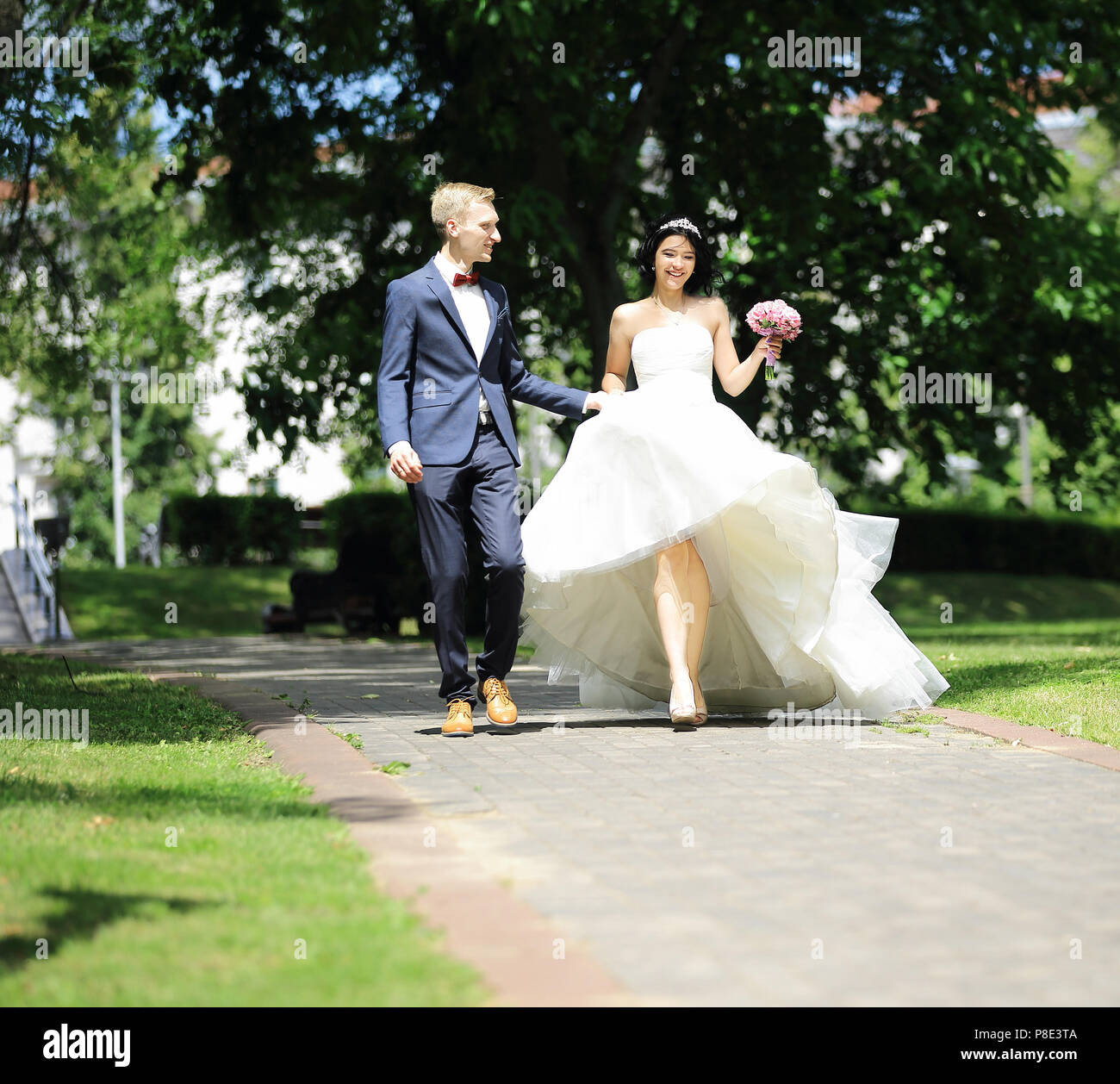 couple walking in the alley of the Park Stock Photo - Alamy