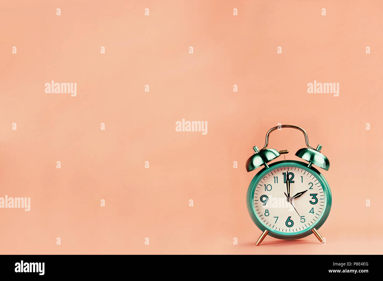 Colorful vintage style alarm clock with room for free background space for text. Stock Photo