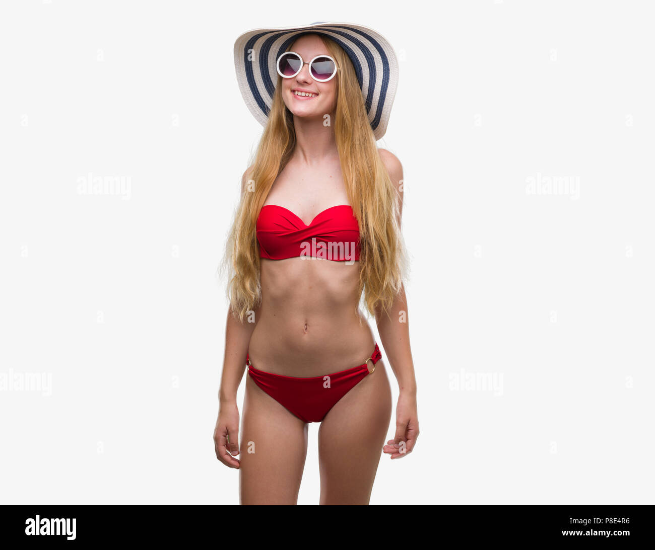 Bikini girl standing wearing sunglasses hi-res stock photography and images  - Alamy