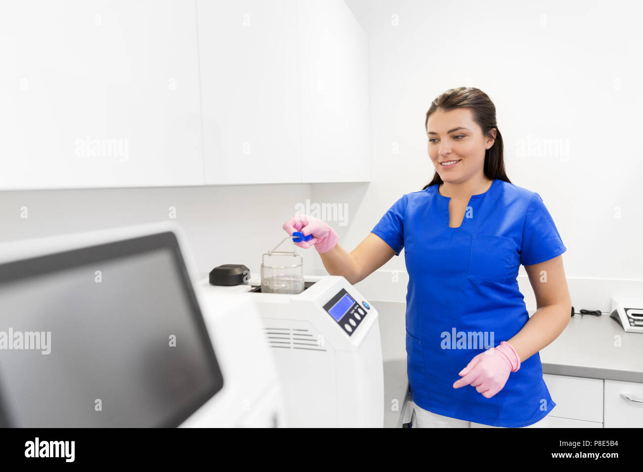 dentist sterilizing tools at dental clinic Stock Photo Alamy