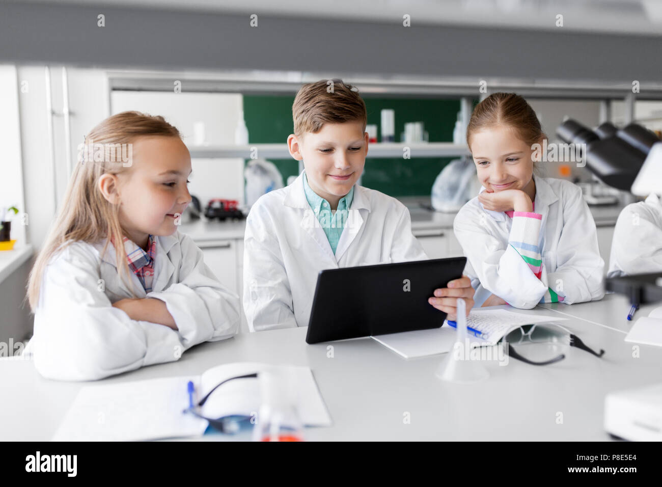 Kids Using Computer Laboratory kids with tablet pc at school laboratory Stock Photo - Alamy