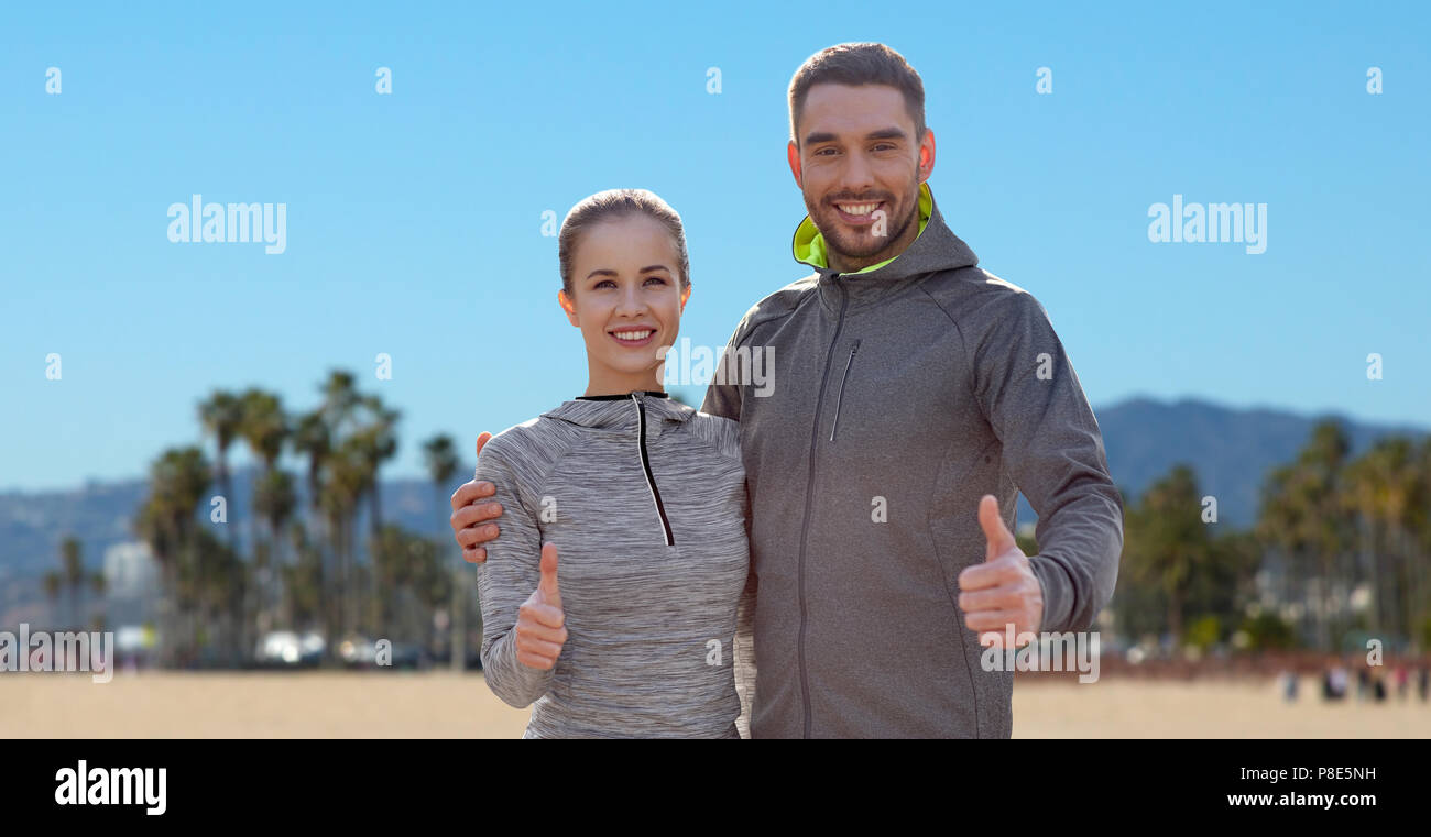 Fit couple showing thumbs up hi-res stock photography and images - Alamy