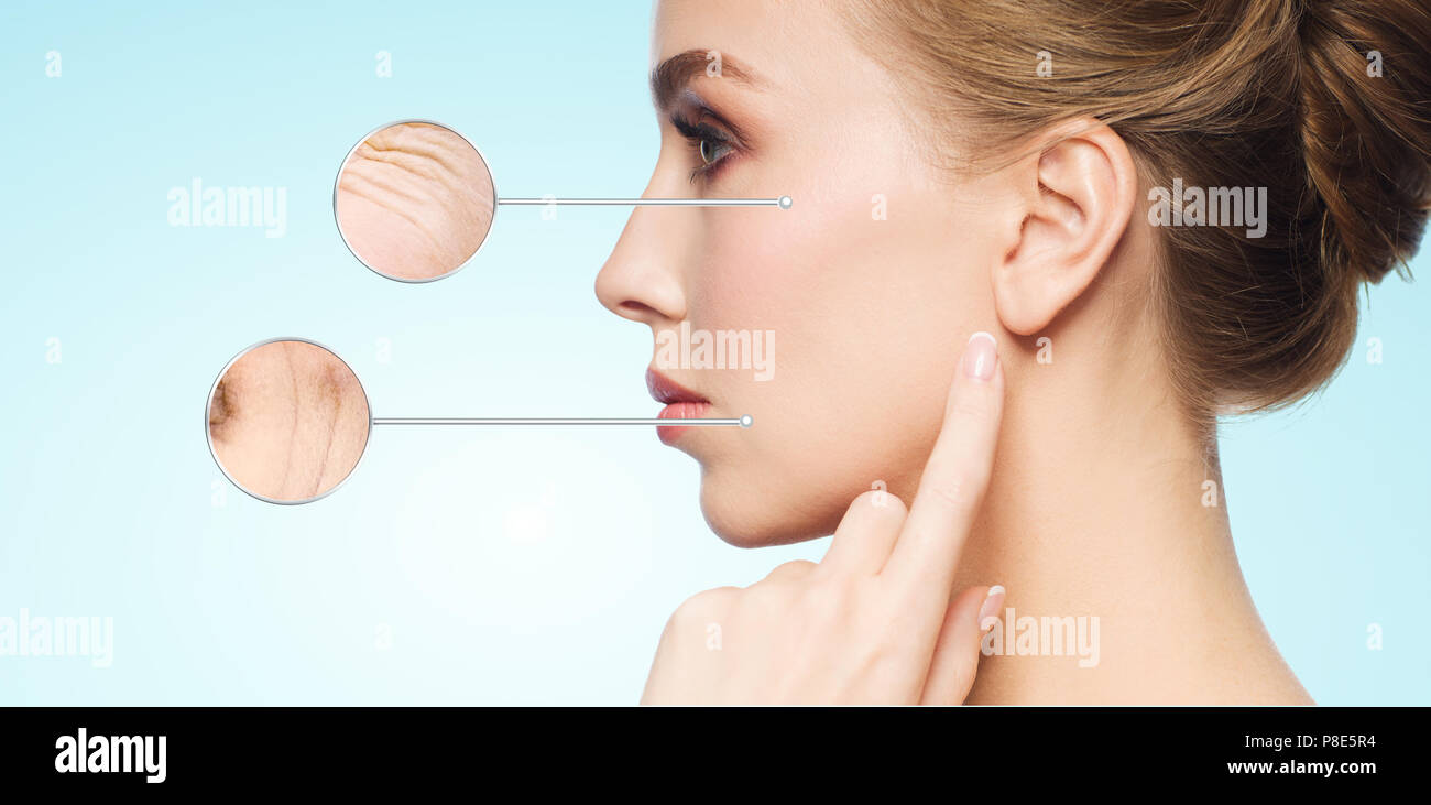 beautiful young woman touching her skin Stock Photo - Alamy