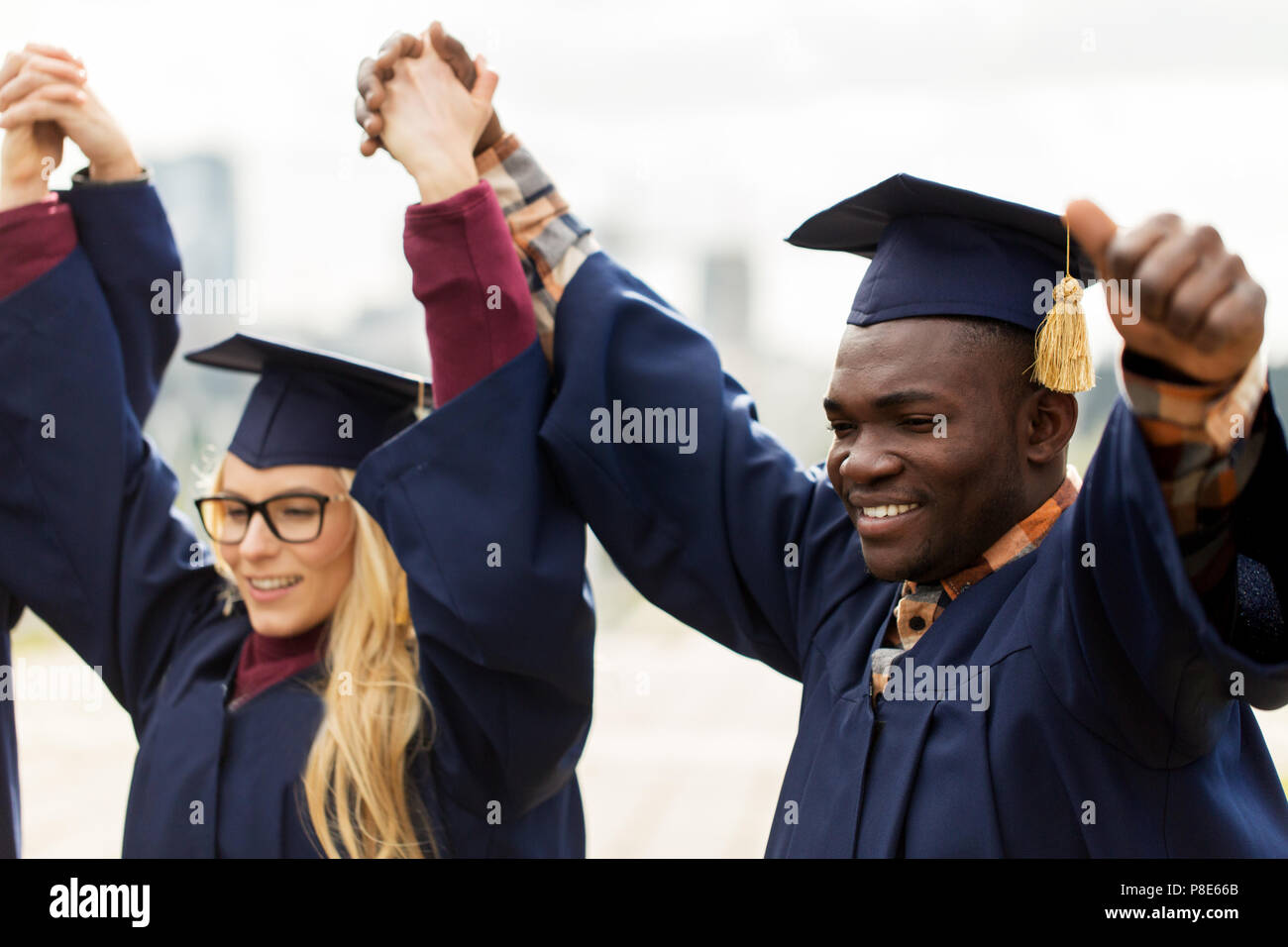 happy students celebrating graduation Stock Photo