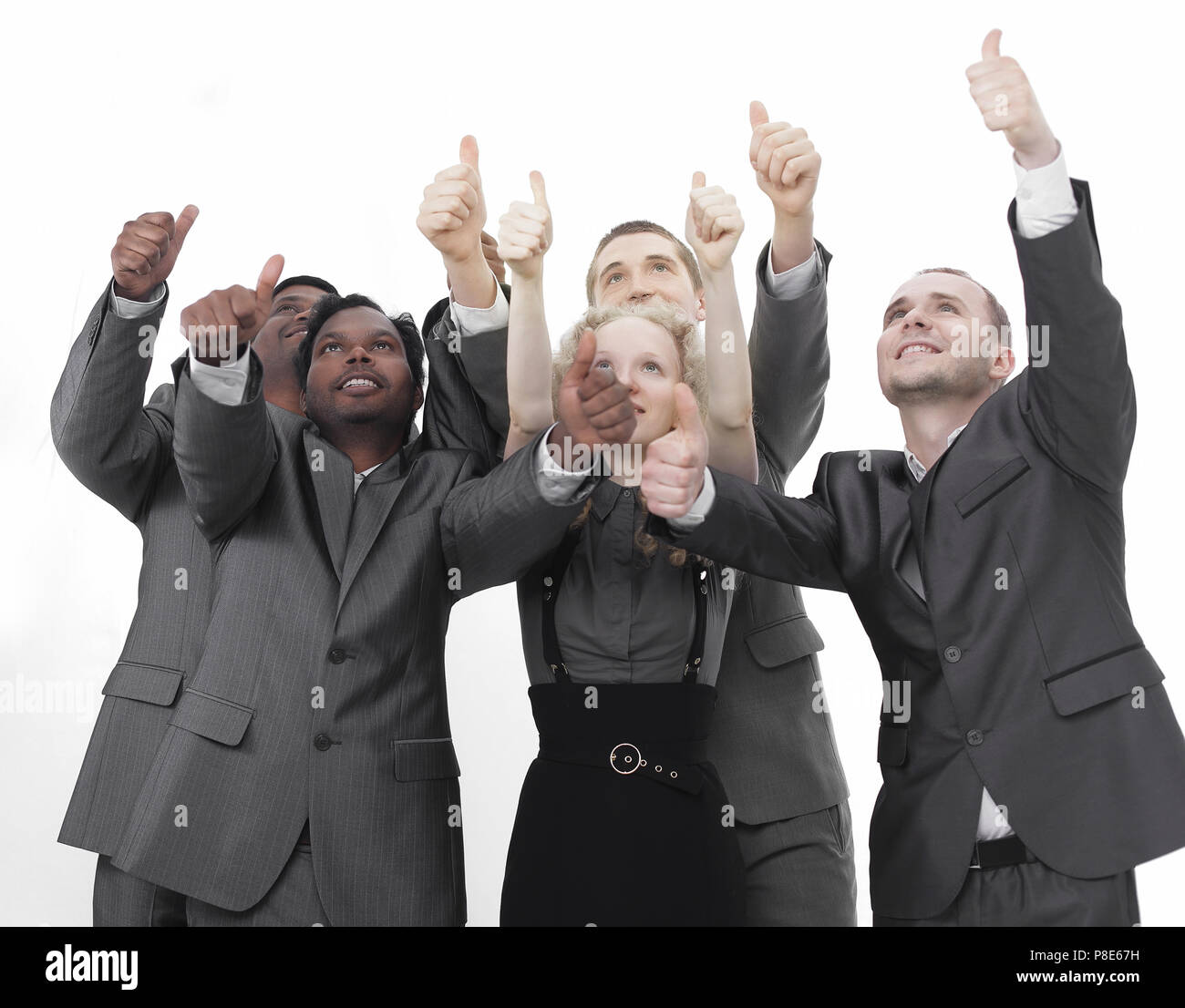 closeup.international business team showing thumbs up Stock Photo - Alamy