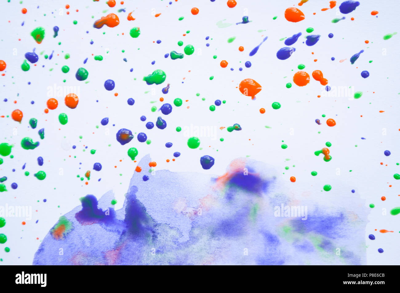 Colorful violet, green and orange watercolor splashes on white background for your design. Stock Photo