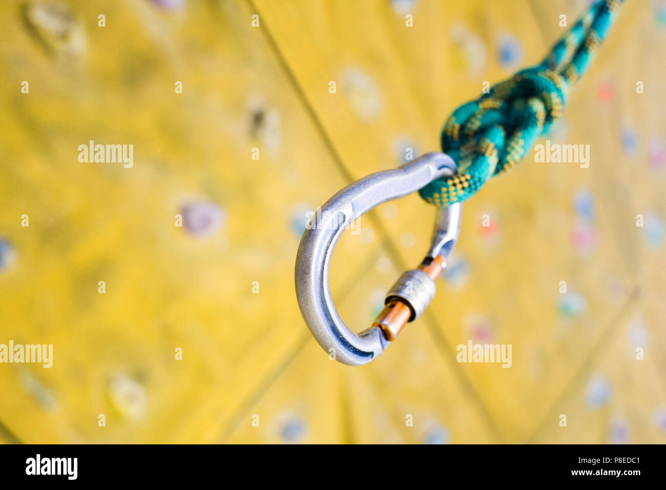 Rope on the background of Grips of climbing wall, Rock climbing  Stock Photo