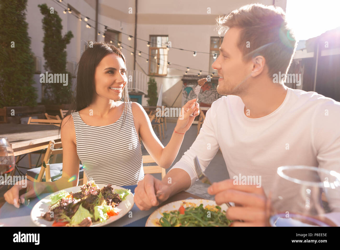 Modern stylish man and woman having anniversary dinner Stock Photo - Alamy