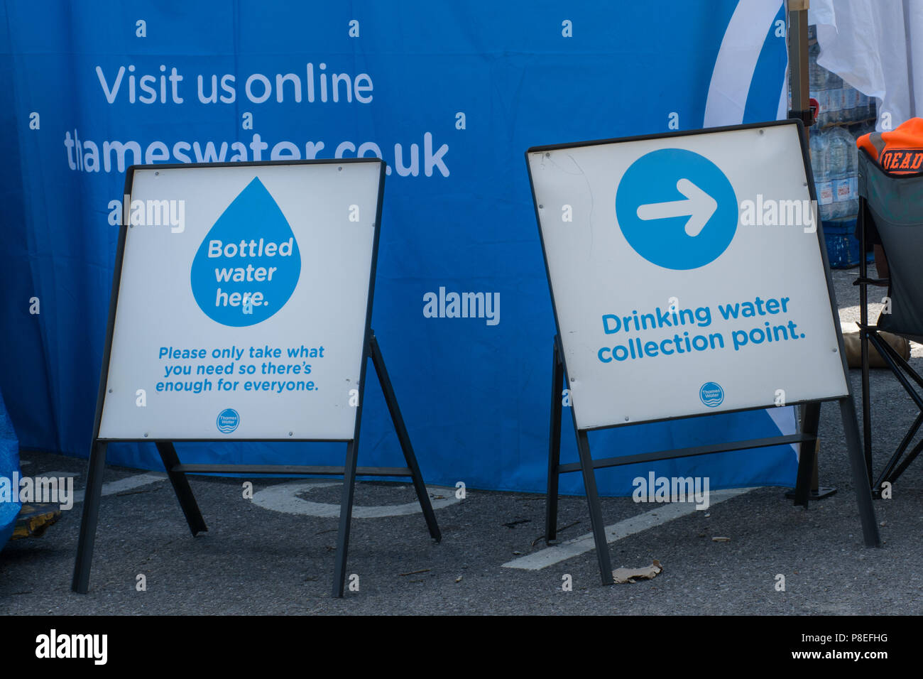 Signs to a drinking water collection point set up by Thameswater following problems with water supply during the heatwave in Haslemere, Surrey, UK Stock Photo