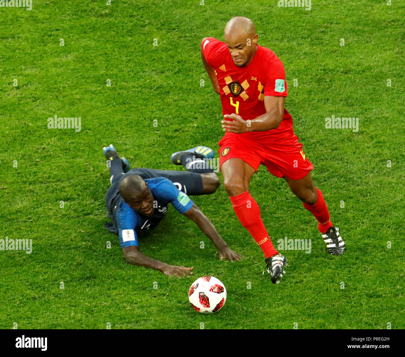 SAINT PETERSBURG, RUSSIA - JULY 10: Ngolo Kante (L) of France national team and Vincent Kompany of Belgium national team vie for the ball during the 2018 FIFA World Cup Russia Semi Final match between France and Belgium at Saint Petersburg Stadium on July 10, 2018 in Saint Petersburg, Russia. MB Media Stock Photo