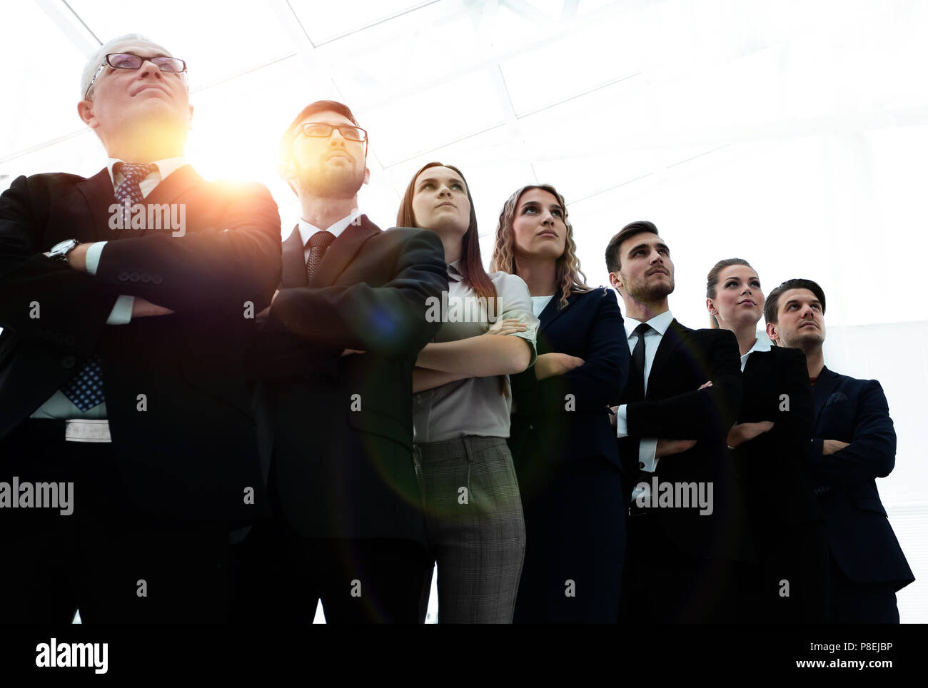 bottom view. successful business team standing together Stock Photo - Alamy