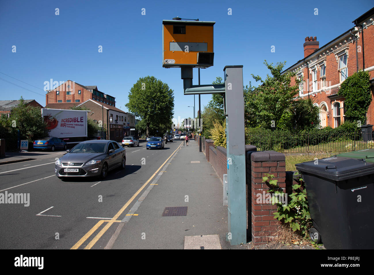 Speed camera on Moseley Road in Birmingham, United Kingdom. A traffic enforcement camera is a camera which may be mounted beside or over a road or installed in an enforcement vehicle to detect traffic regulation violations, including speeding. Stock Photo