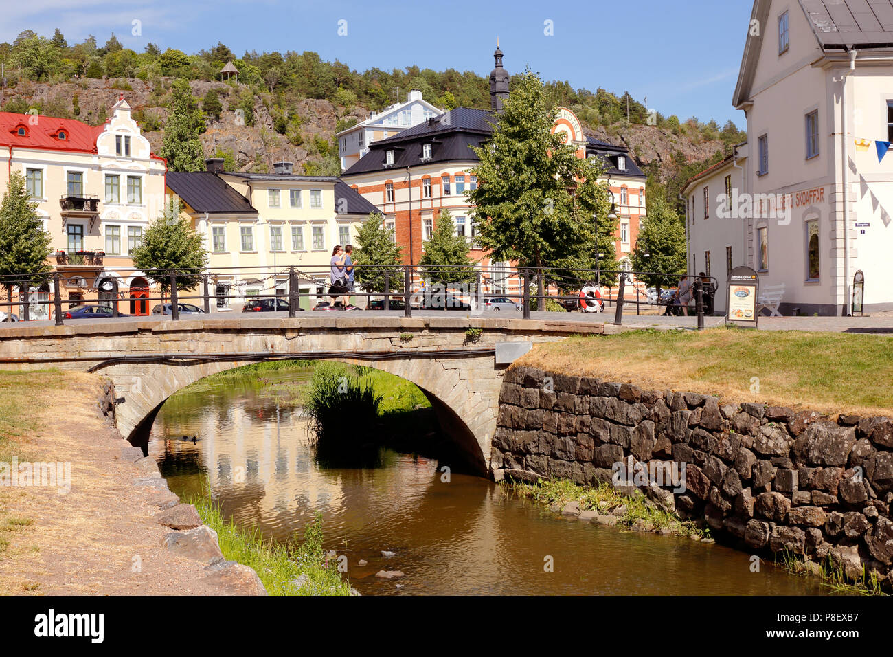 Soderkoping, Sweden - June 28, 2018: View of the Soderkoping river with a bridge in the town center. Stock Photo