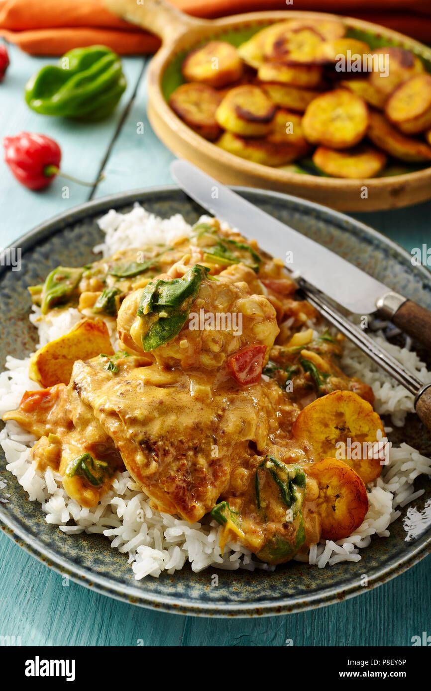 Chicken thighs in peanut butter curry sauce Stock Photo Alamy