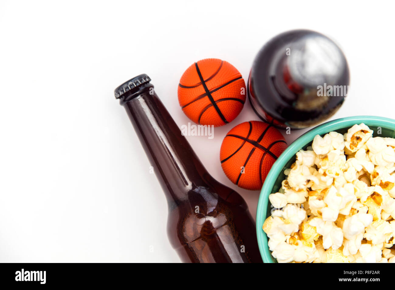 Baasketball match party. Beer bottle with basketball and popcorn Stock Photo