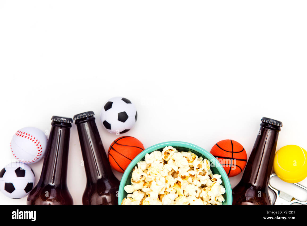 Sports match party. Beer bottle with football, basketball, baseball balls Stock Photo