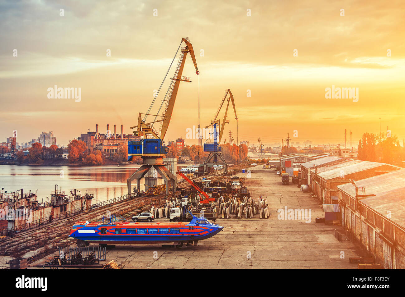 Portal cranes and high-speed hydrofoil ship in Kyiv harbor Stock Photo