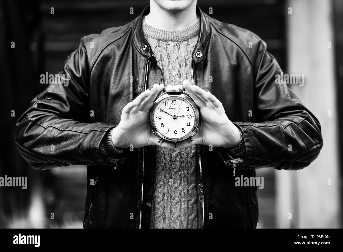 Man Hand Clock Vintage alarm clock in the hands of man Stock Photo - Alamy