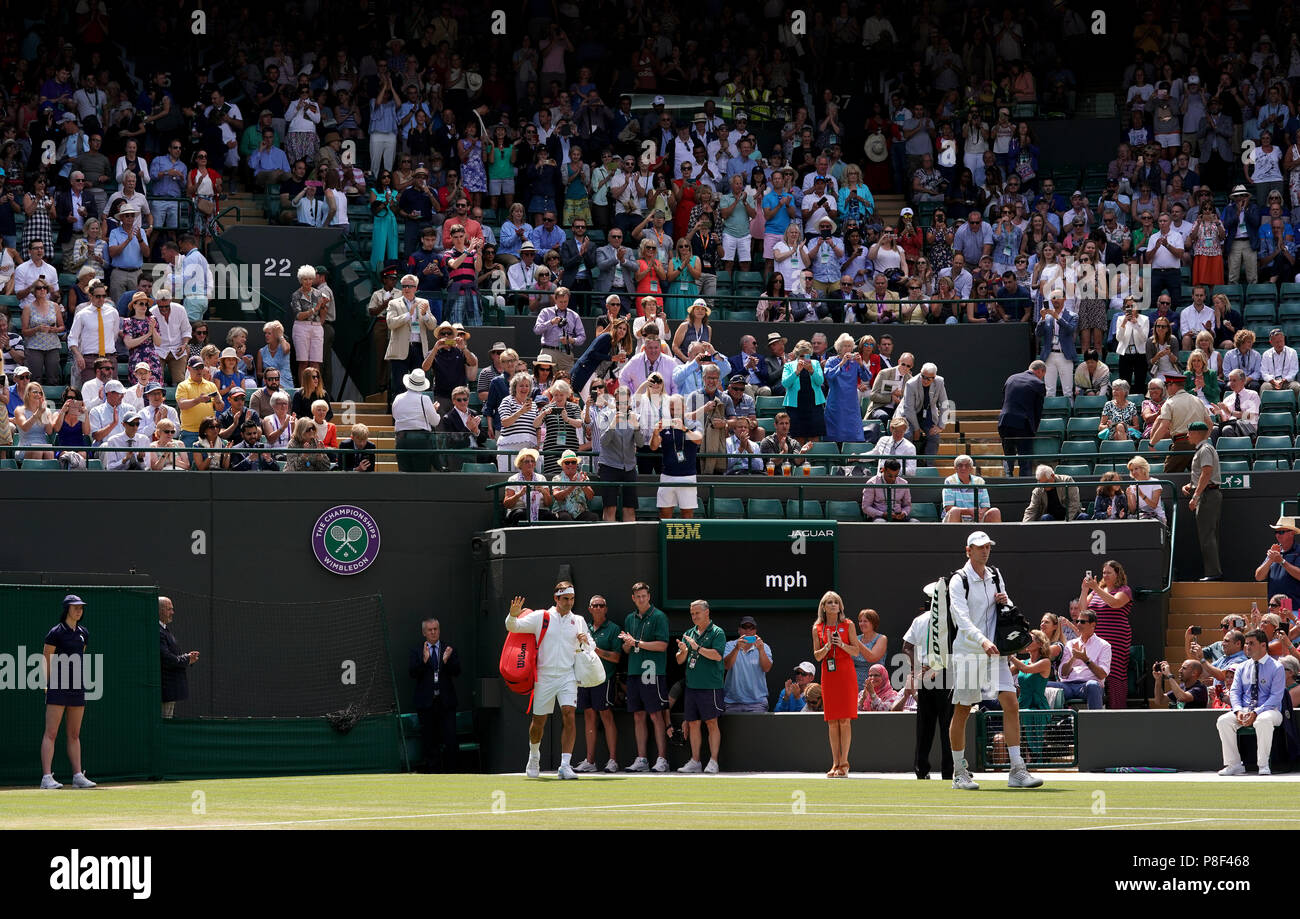 Roger Federer and Kevin Anderson walk out onto court one for their Roger Federer and Kevin Anderson walk out onto court one for their