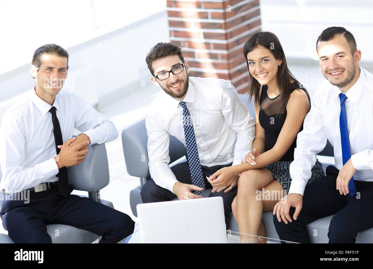 successful business team sitting in office lobby Stock Photo - Alamy