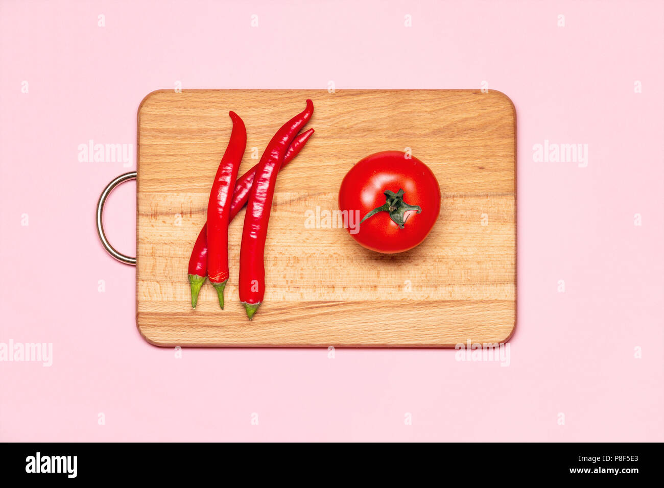 Healthy Eating. Three Fresh Red Chilli Pepper Near One Tomato On A