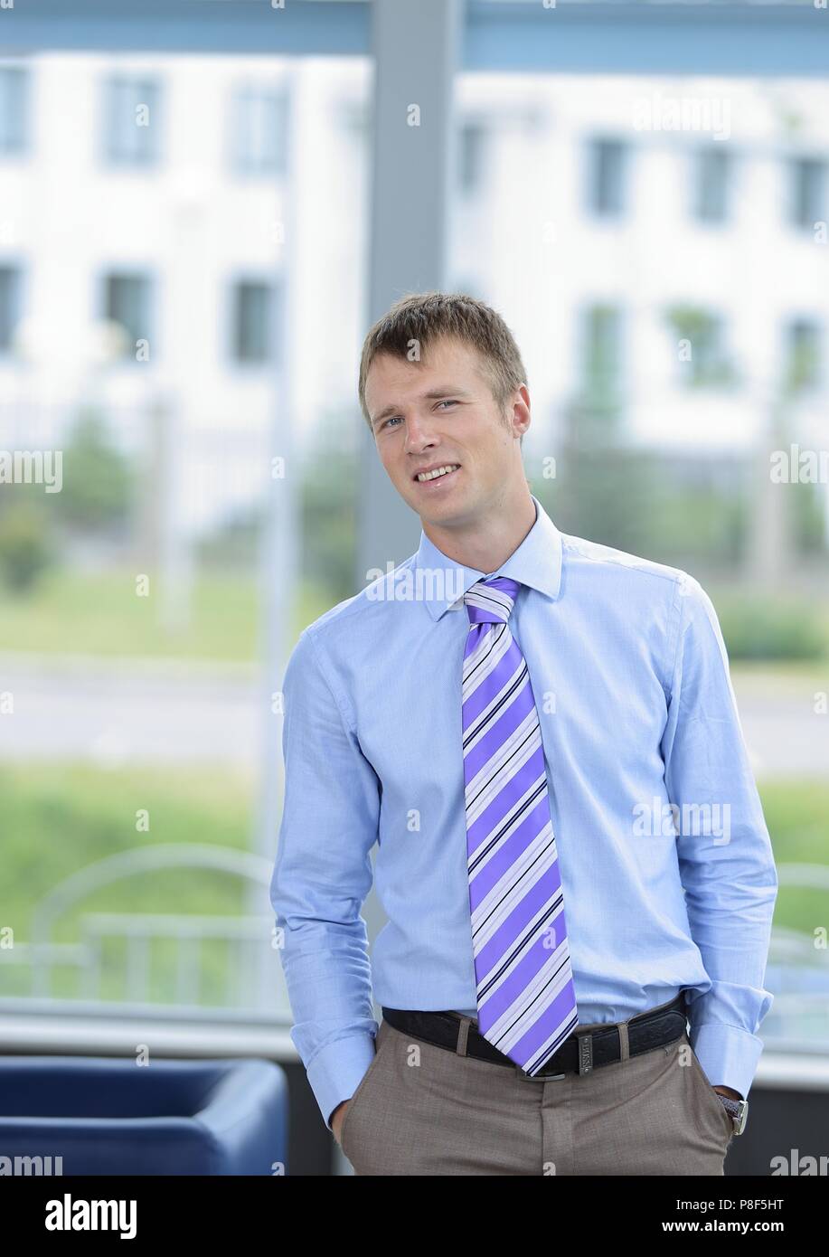 Portrait of a businessman with arms crossed Stock Photo - Alamy