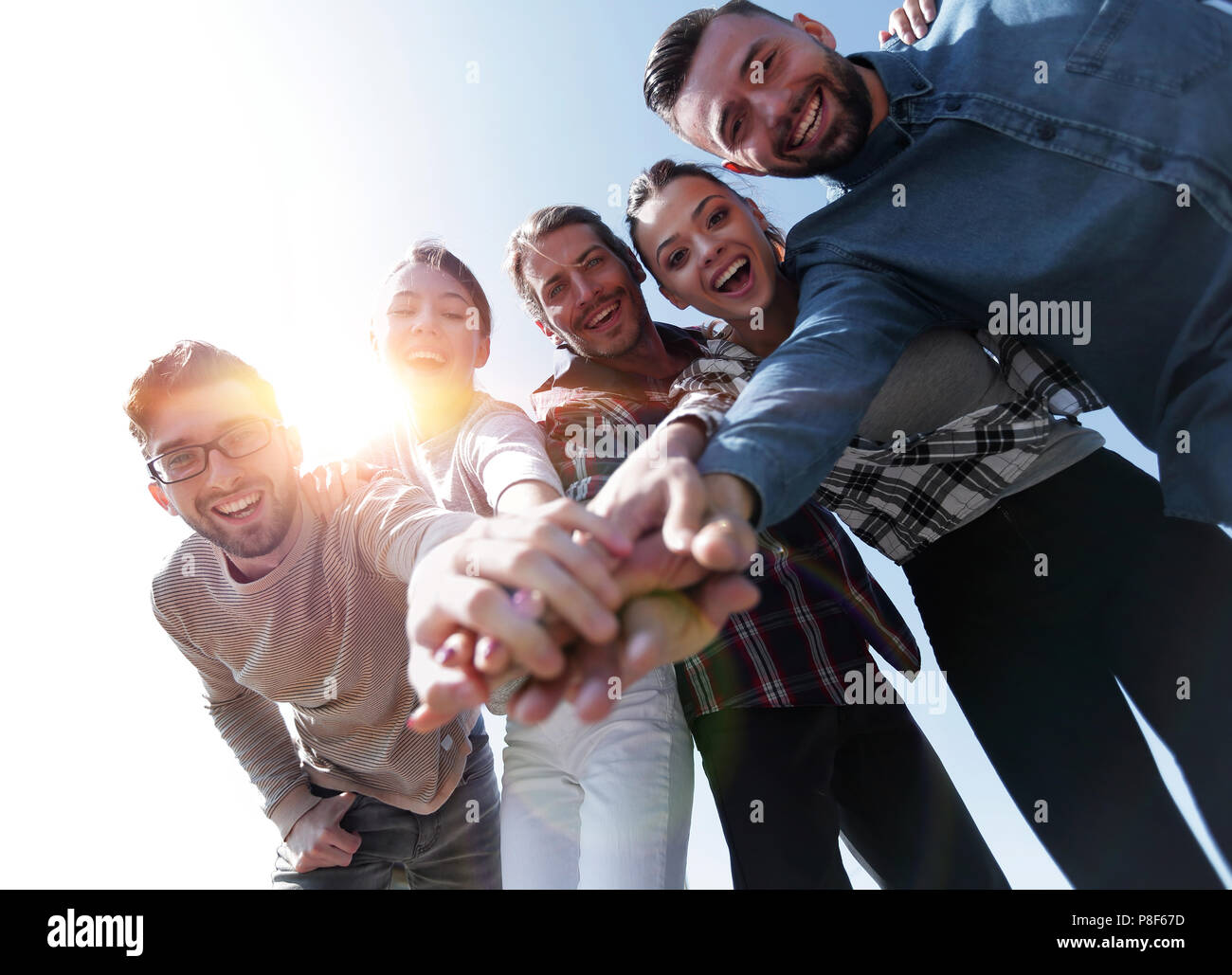 Creative team hands clasped hi-res stock photography and images - Alamy