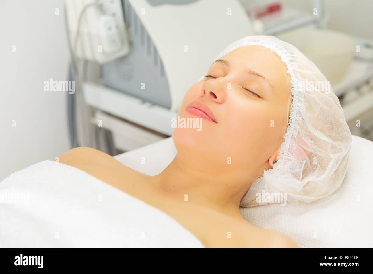 Cosmetologist removing facial mask from female face Stock Photo Alamy