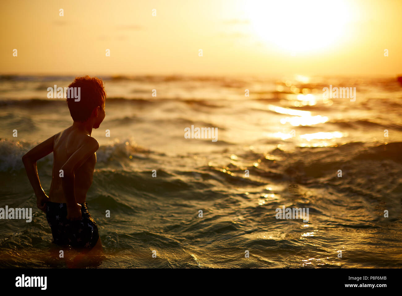 Child Looking At Reflection In Water High Resolution Stock Photography ...