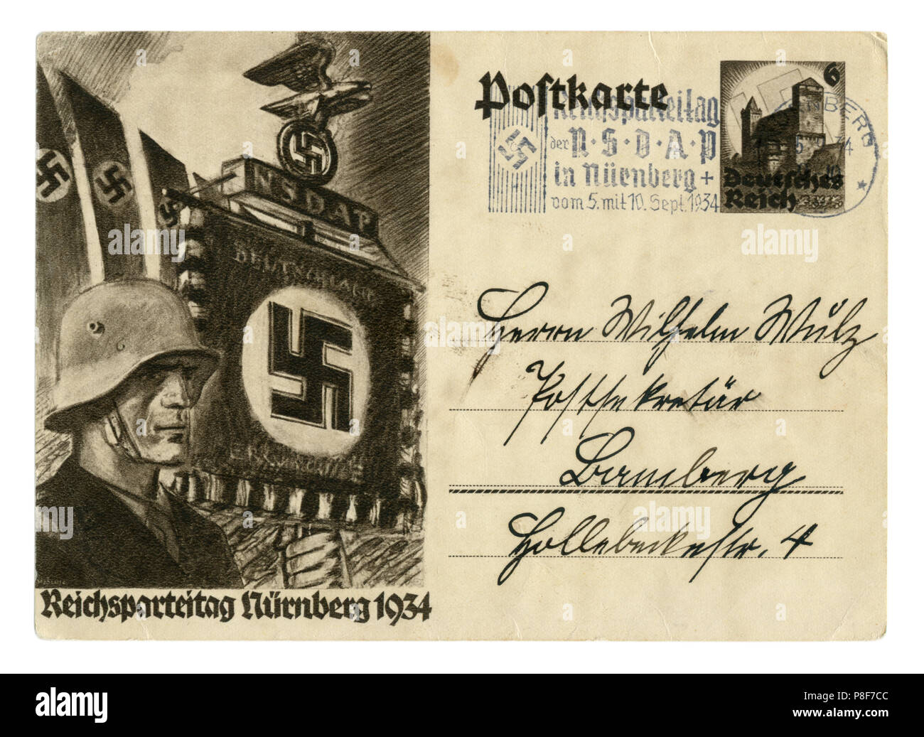 German historical postal card: The 6th party Congress of the NSDAP in Nuremberg in 1934, SS standard bearer in a steel helmet. Germany, Third Reich Stock Photo