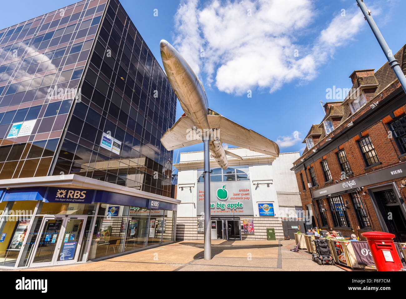 Hawker Hunter aircraft mounted on a pole outside the Big Apple entertainment centre in Crown Square, Woking town centre, Surrey, UK Stock Photo